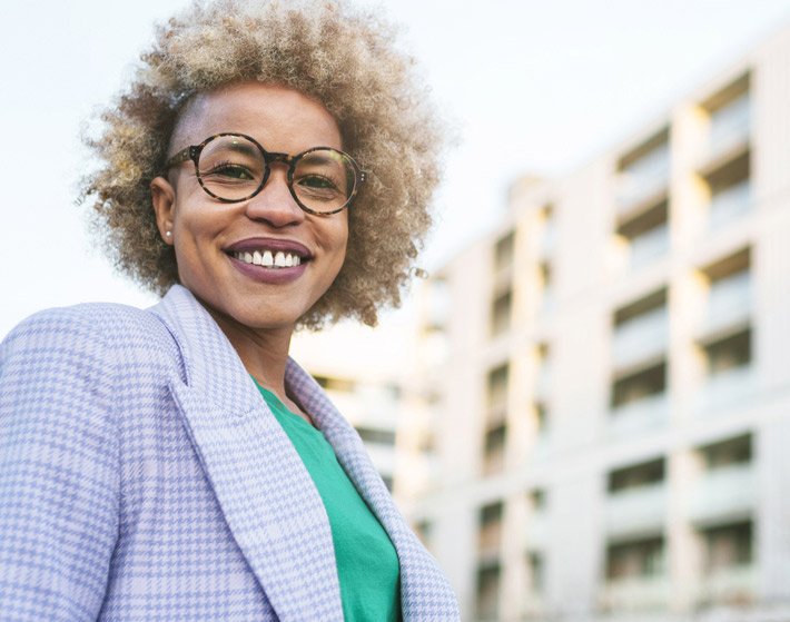 woman standing in front of a building